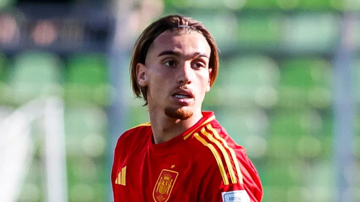 Player in red Spain jersey on the field
