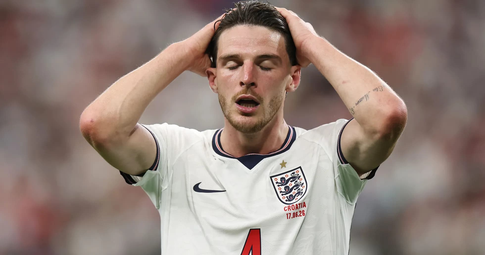 Player holding head in disappointment during match