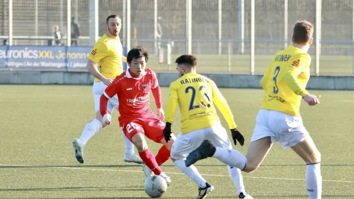 Player dribbling the ball during Monheim vs Ratingen match