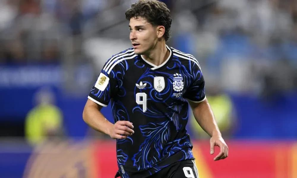 Player in Argentina kit running on the field