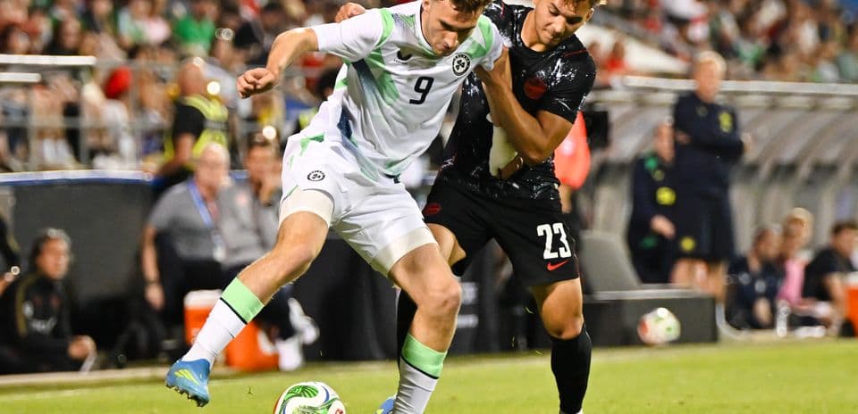 Two players competing for the ball during match