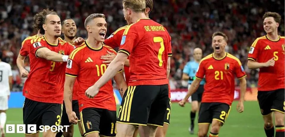 Belgian players celebrating a goal on the field