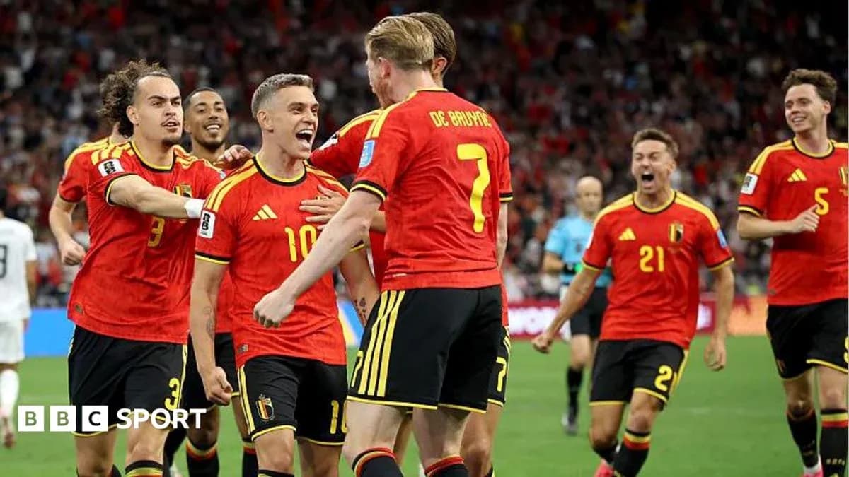 Belgian players celebrating a goal on the field