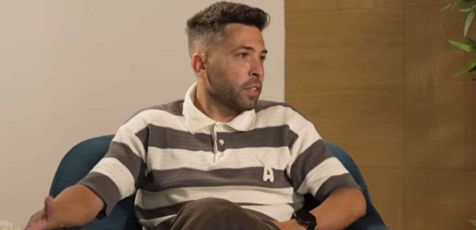 Man sitting in armchair during interview