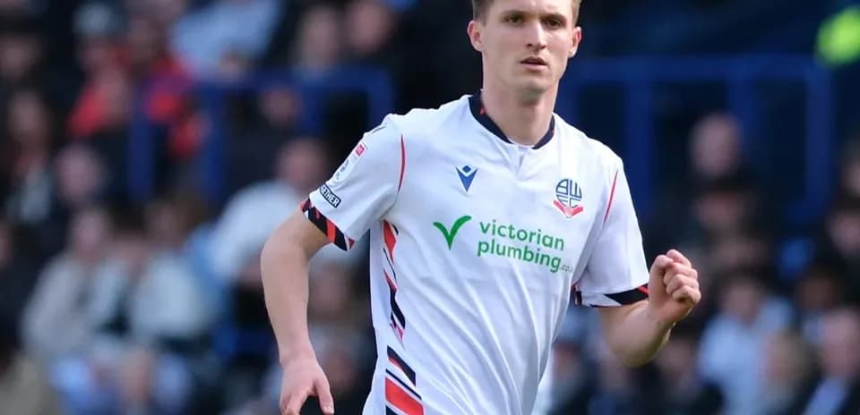 Bolton player running on the pitch during match