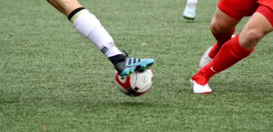 Players competing for the ball during match