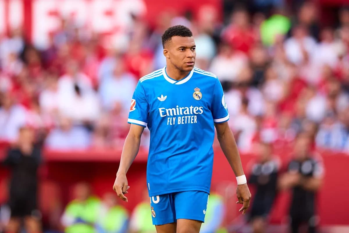Player walking on pitch in blue Real Madrid kit