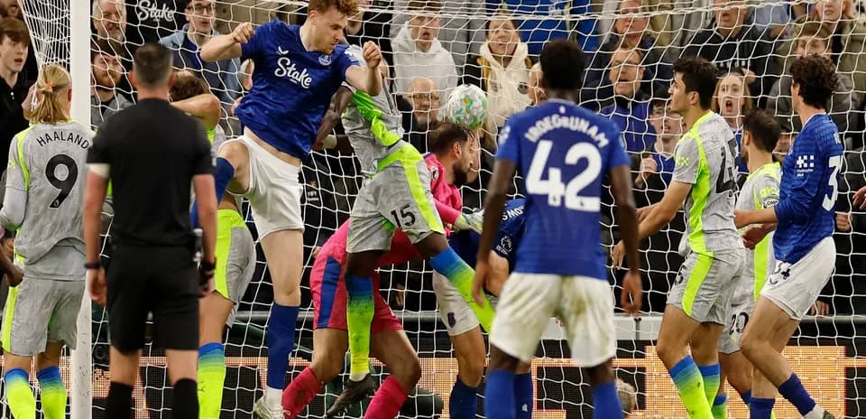 Players contesting a corner during Everton match
