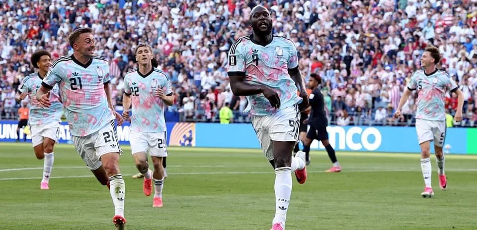 Players celebrating a goal during a soccer match