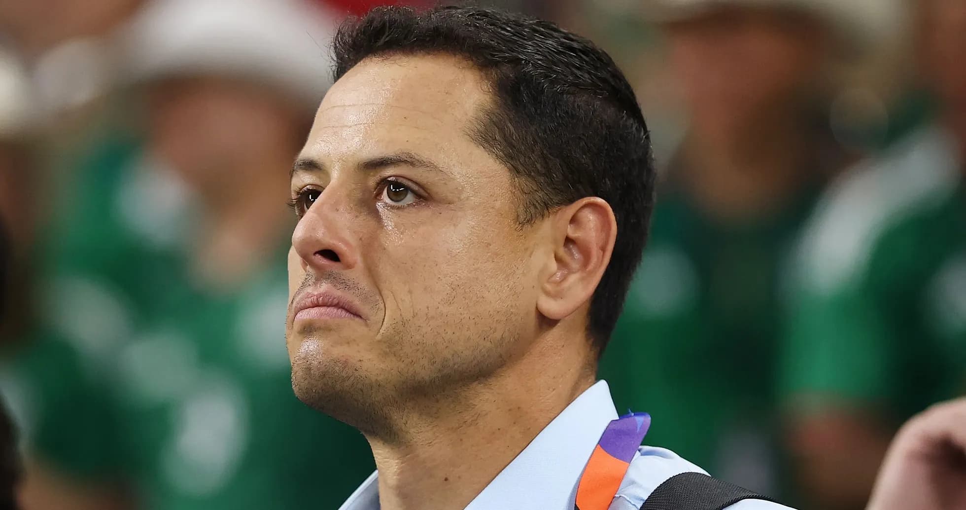 Man with tearful expression at event