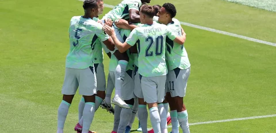 Players celebrating a goal during match
