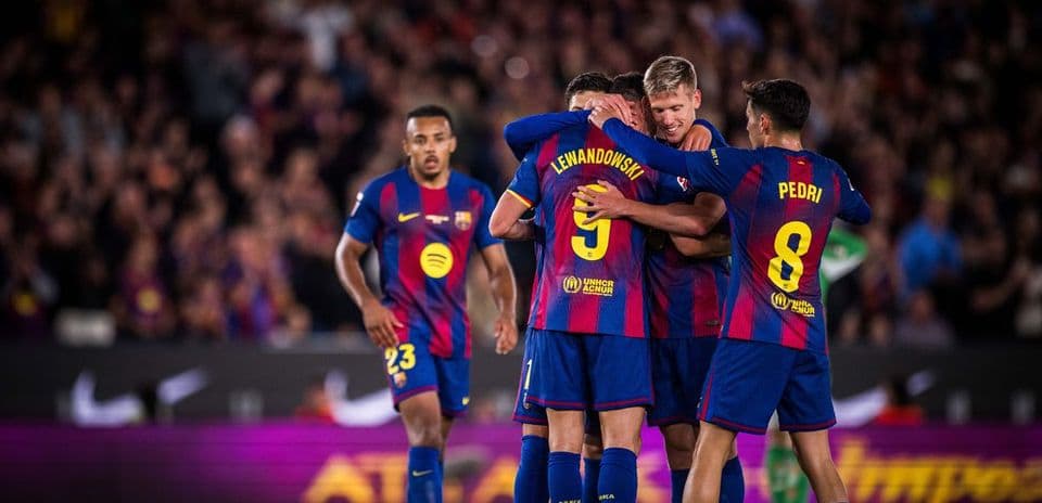 Barcelona players celebrating a goal during La Liga match
