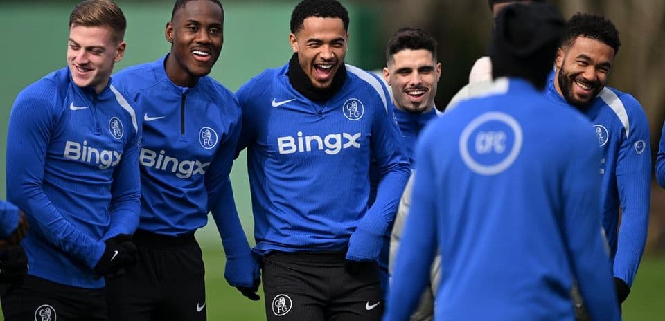Players laughing during training session in blue jerseys