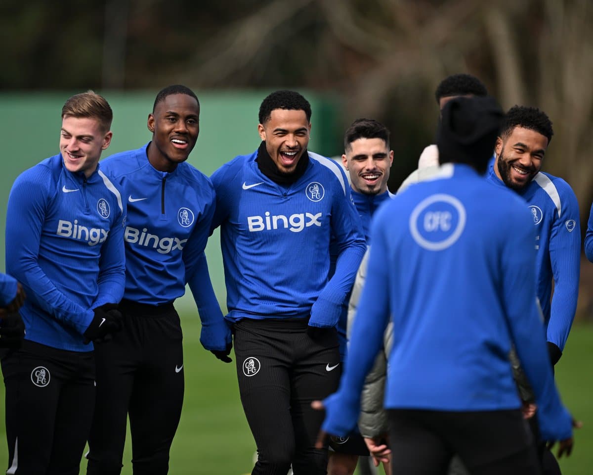Players laughing during training session in blue jerseys