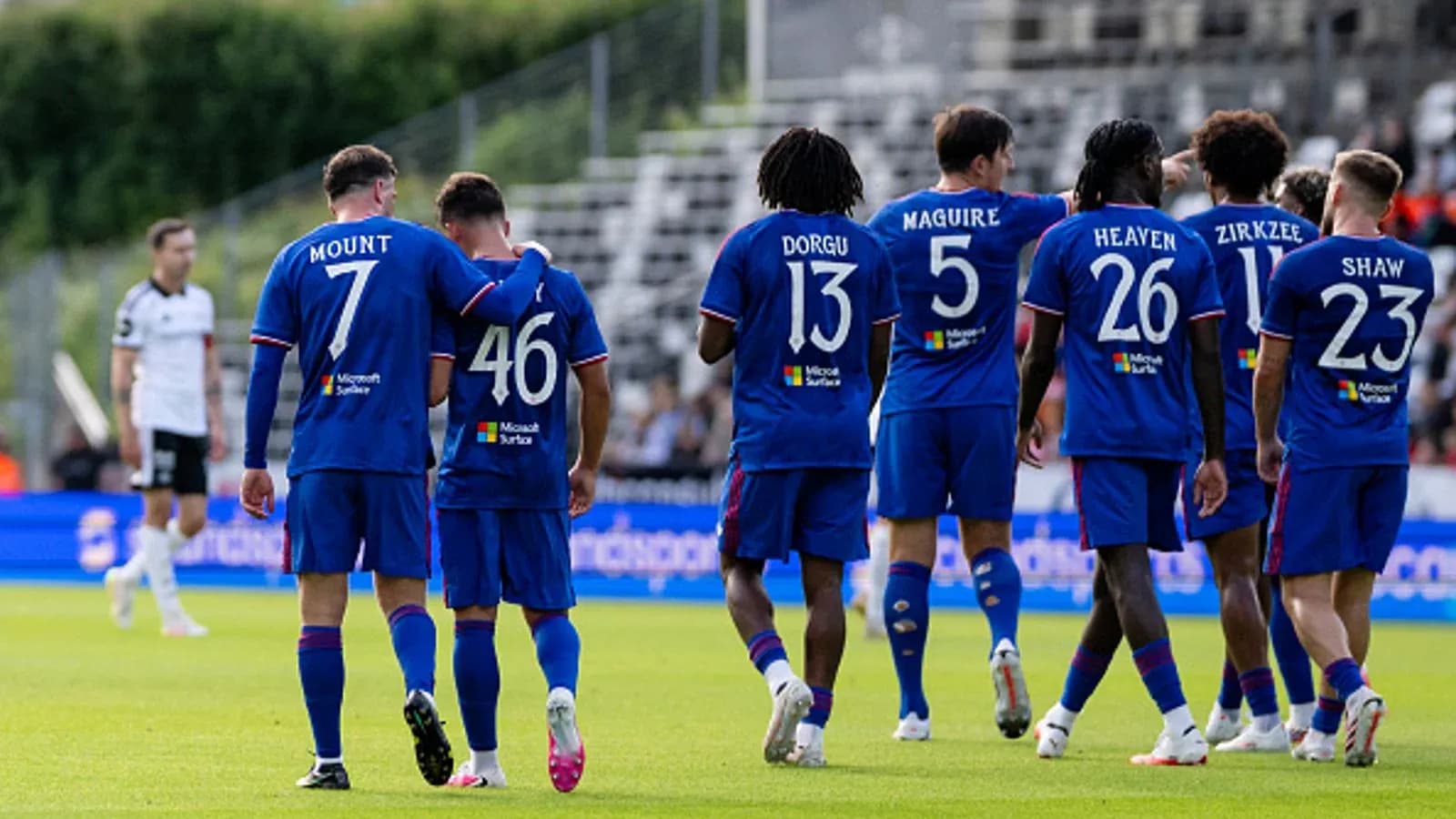 Team celebrating after scoring a goal during match