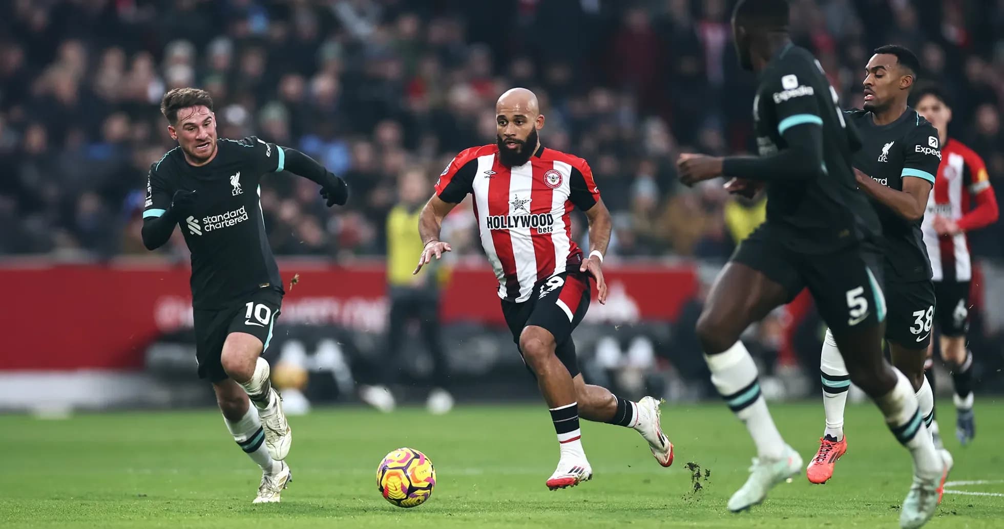Liverpool player chasing the ball against Brentford