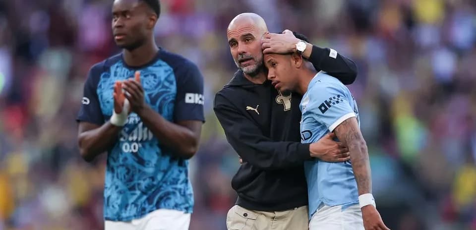 Manager comforting player after match conclusion
