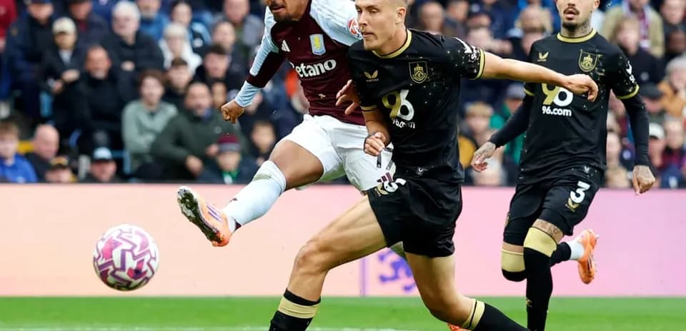 Player shooting during Burnley vs Aston Villa match