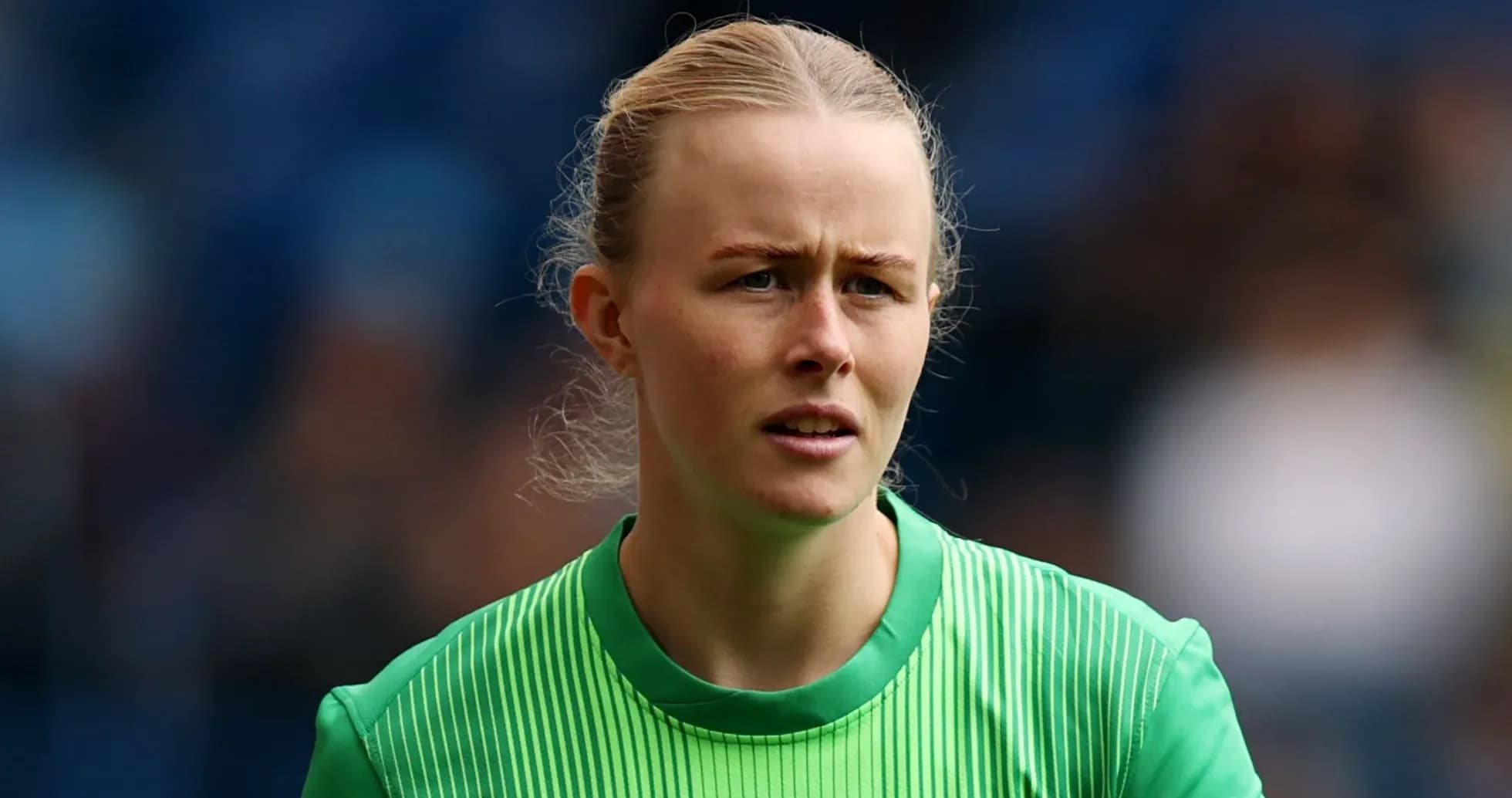 Goalkeeper wearing green kit during match preparation