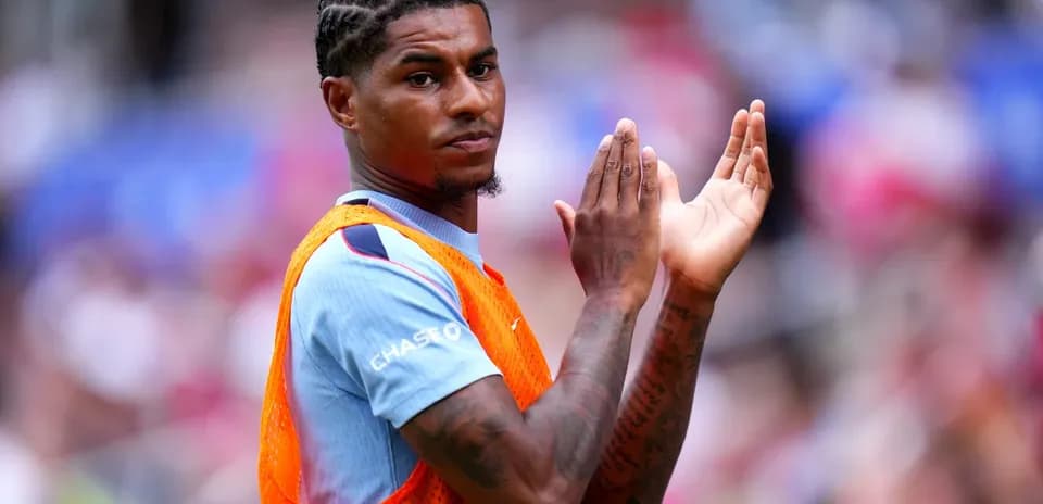 Player clapping while wearing training bib on field