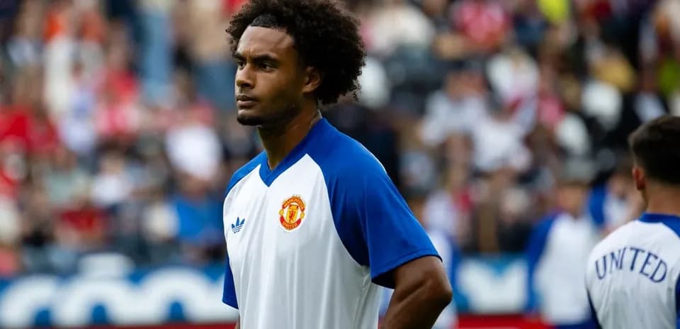 Player warming up before match wearing Manchester United jersey