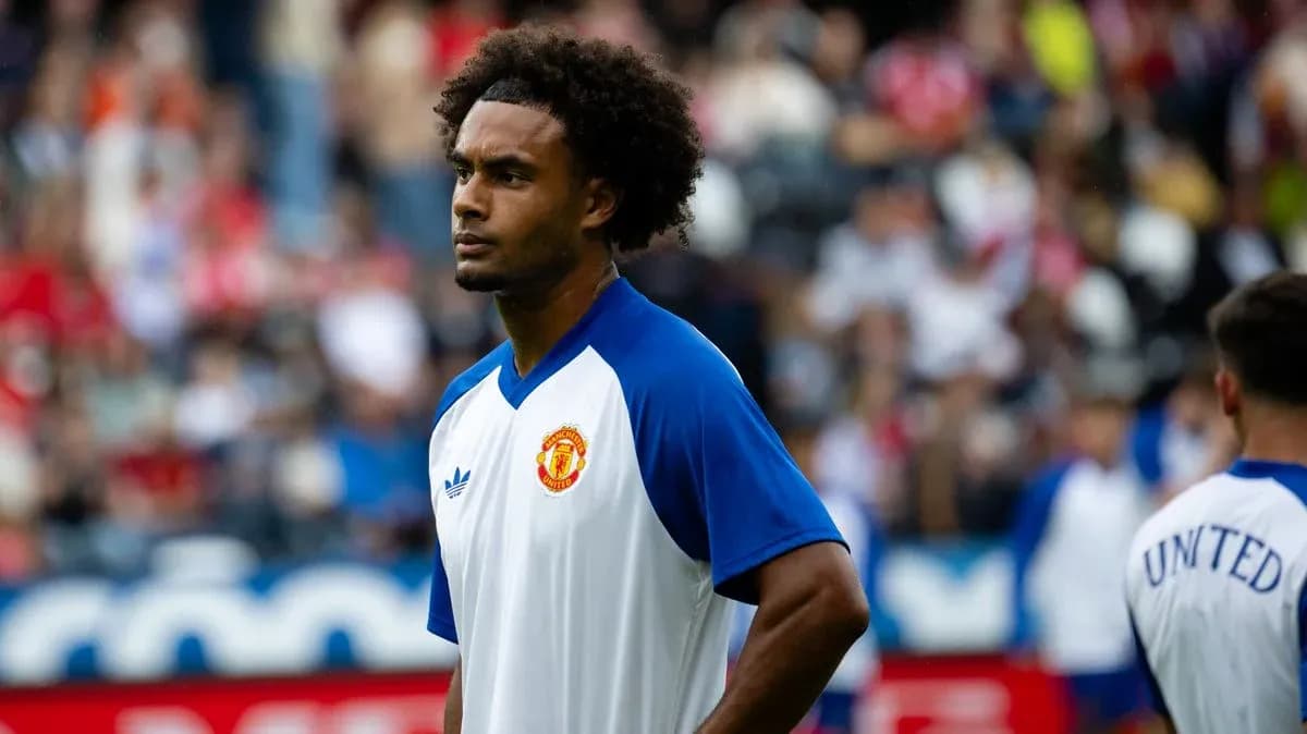 Player warming up before match wearing Manchester United jersey