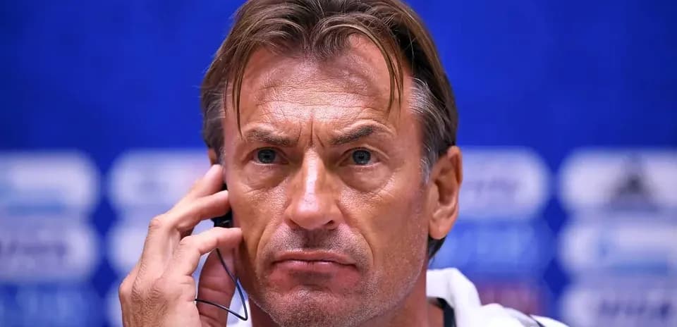 Coach at press conference with headset on