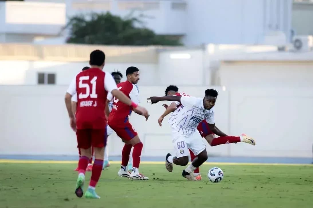 Al Ain U23 player dribbling past defenders