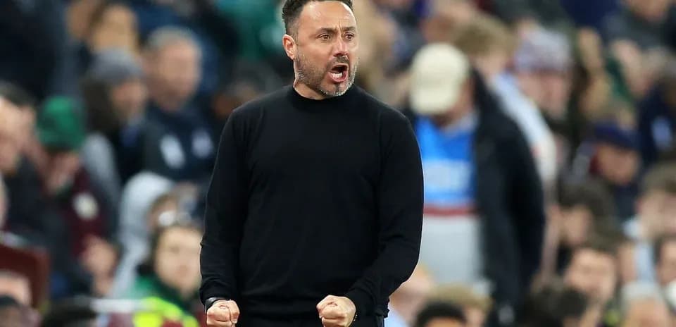Coach celebrating during a match on the sideline