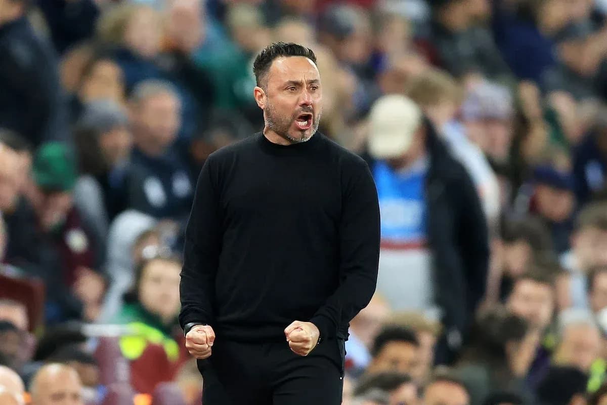 Coach celebrating during a match on the sideline