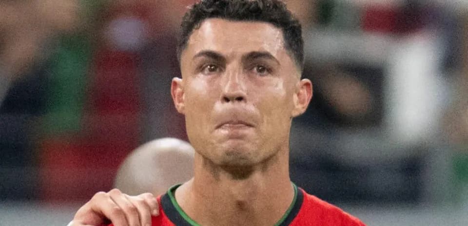 Player in red jersey with emotional expression