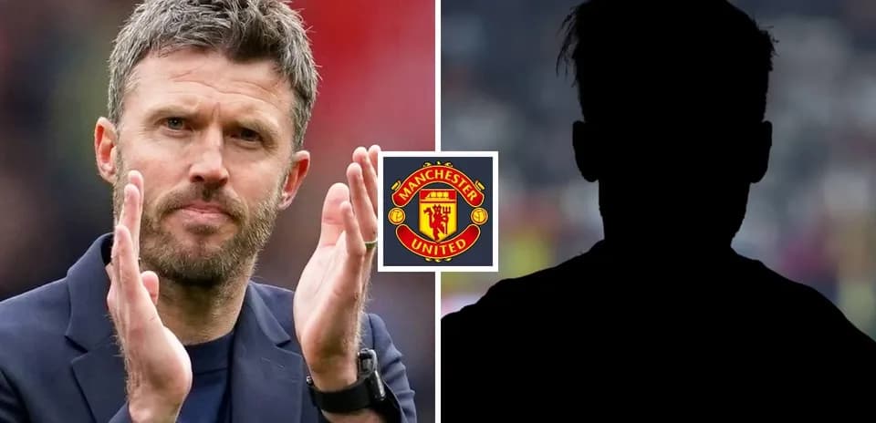 Coach applauding with Manchester United logo in background
