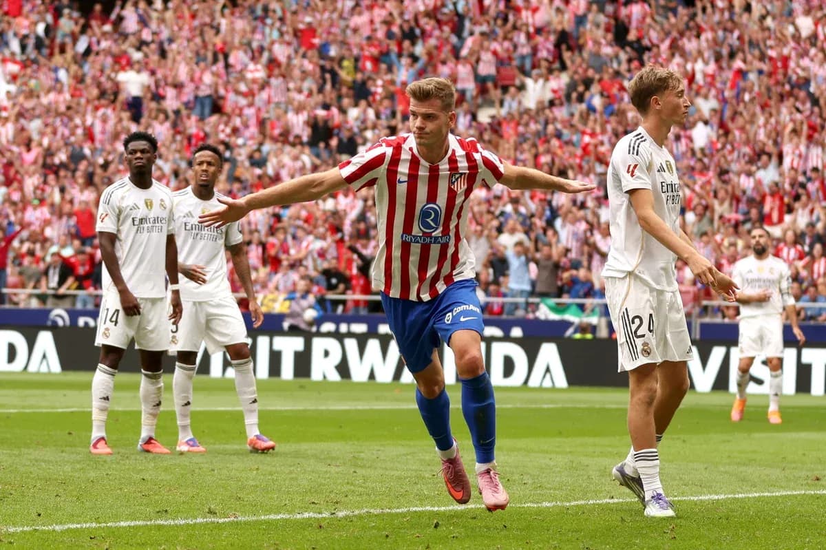 Atletico player celebrating goal against Real Madrid