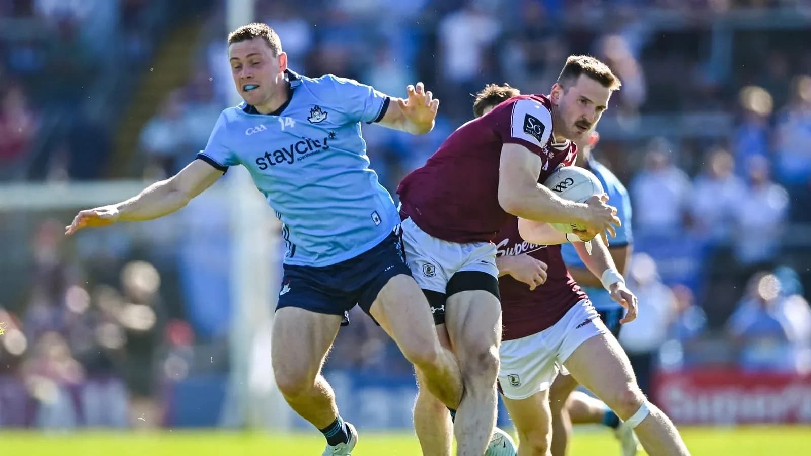 Player tackling opponent while carrying the ball