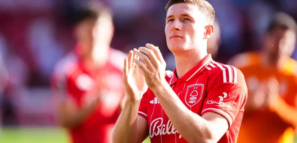Player applauding fans in Nottingham Forest jersey