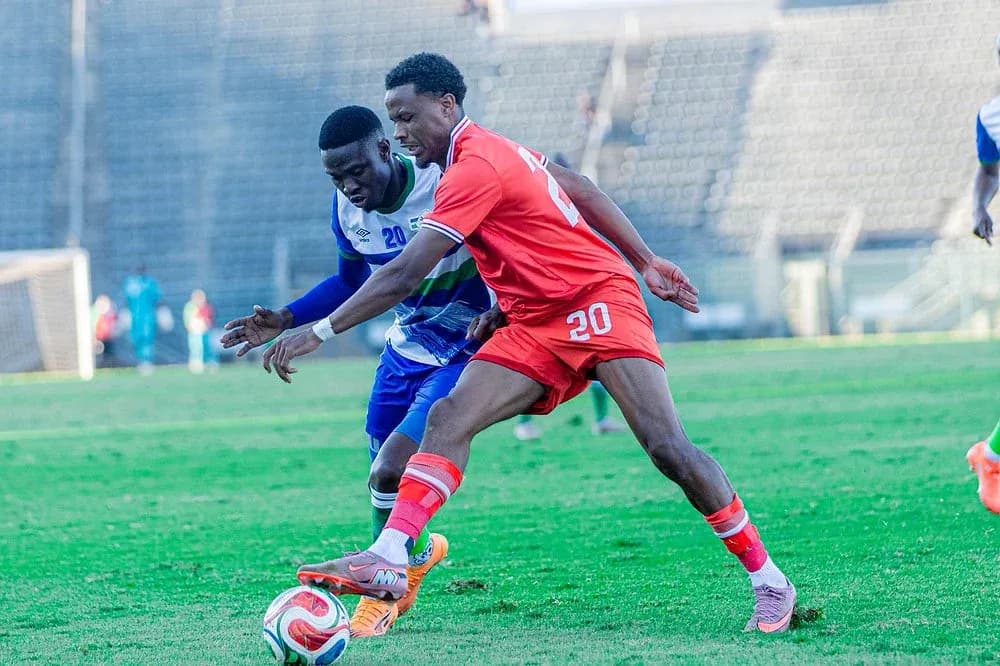 Two players contesting for the ball on the field
