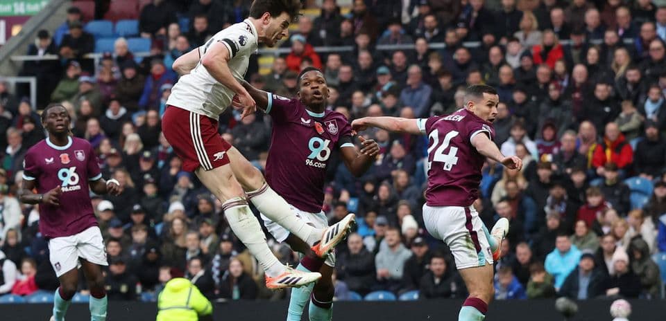 Arsenal player attempting a header against Burnley