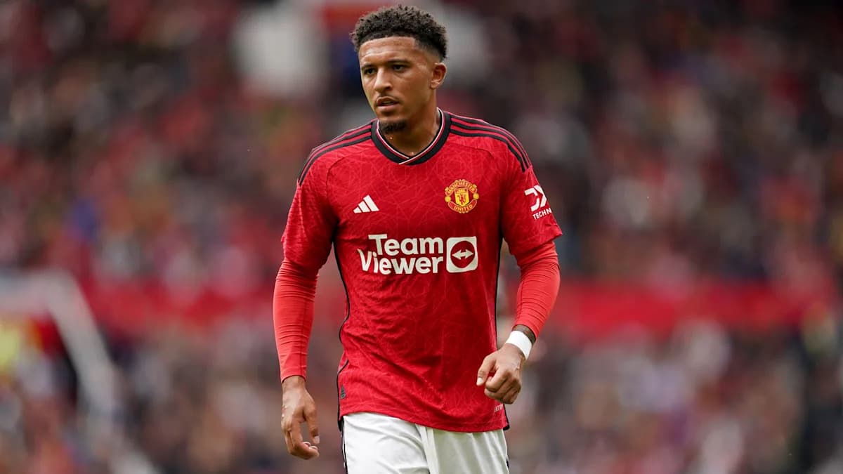 Player in Manchester United jersey on the pitch