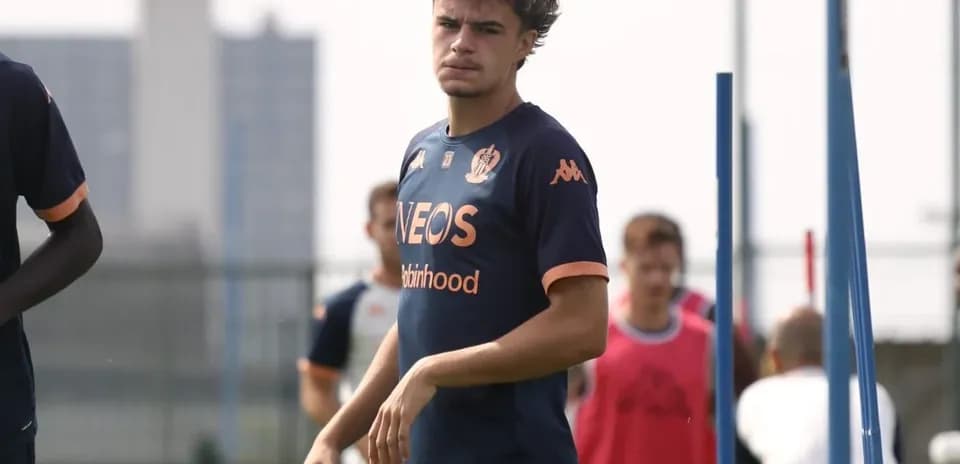 Player walking during training session with teammates
