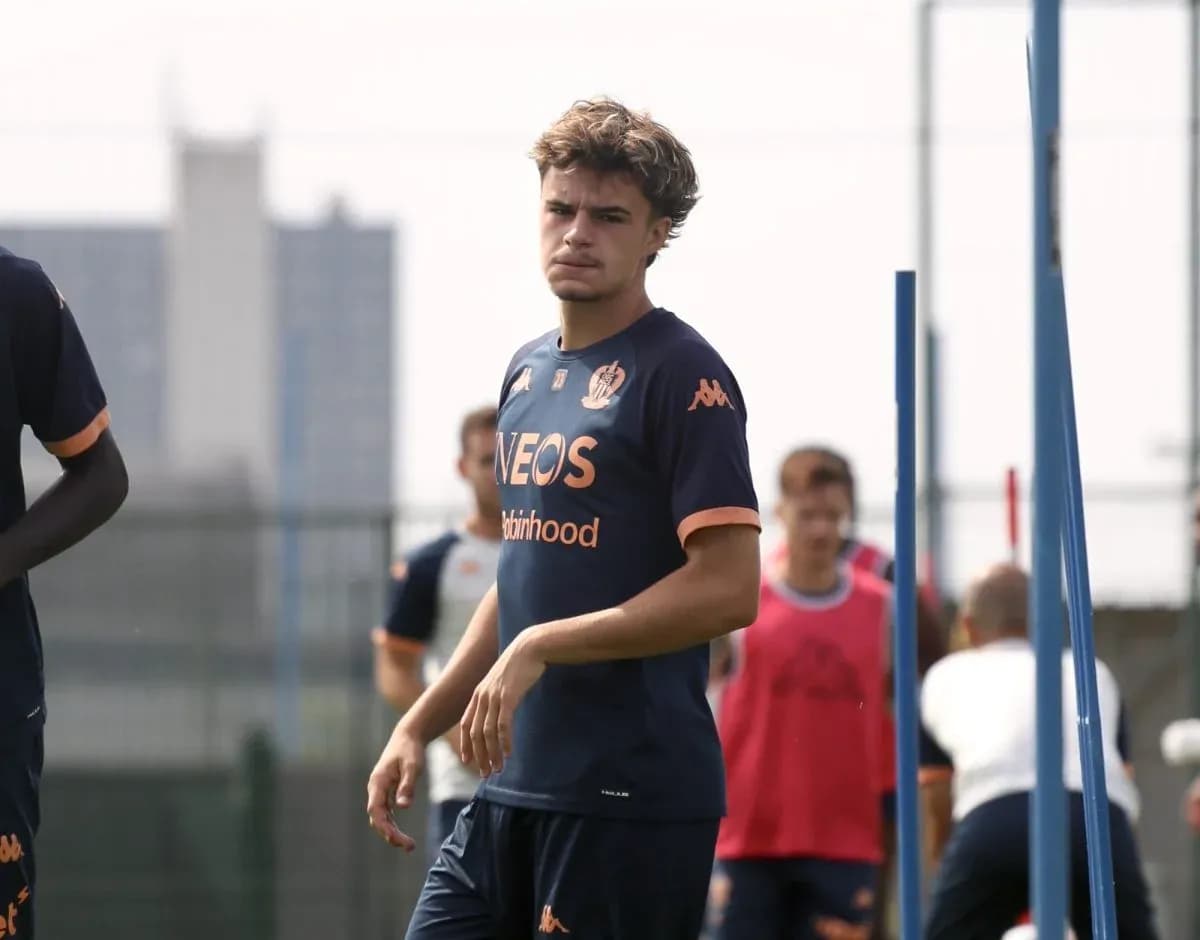 Player walking during training session with teammates