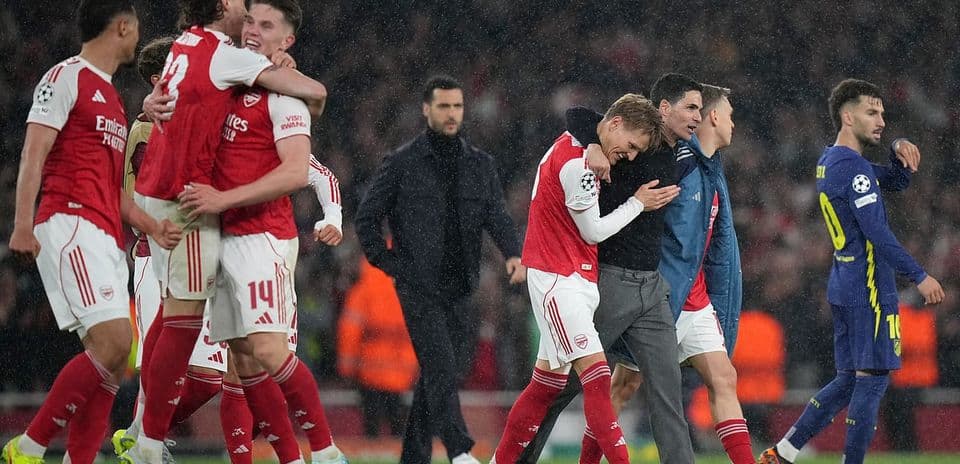 Arsenal players celebrating victory over Atletico Madrid