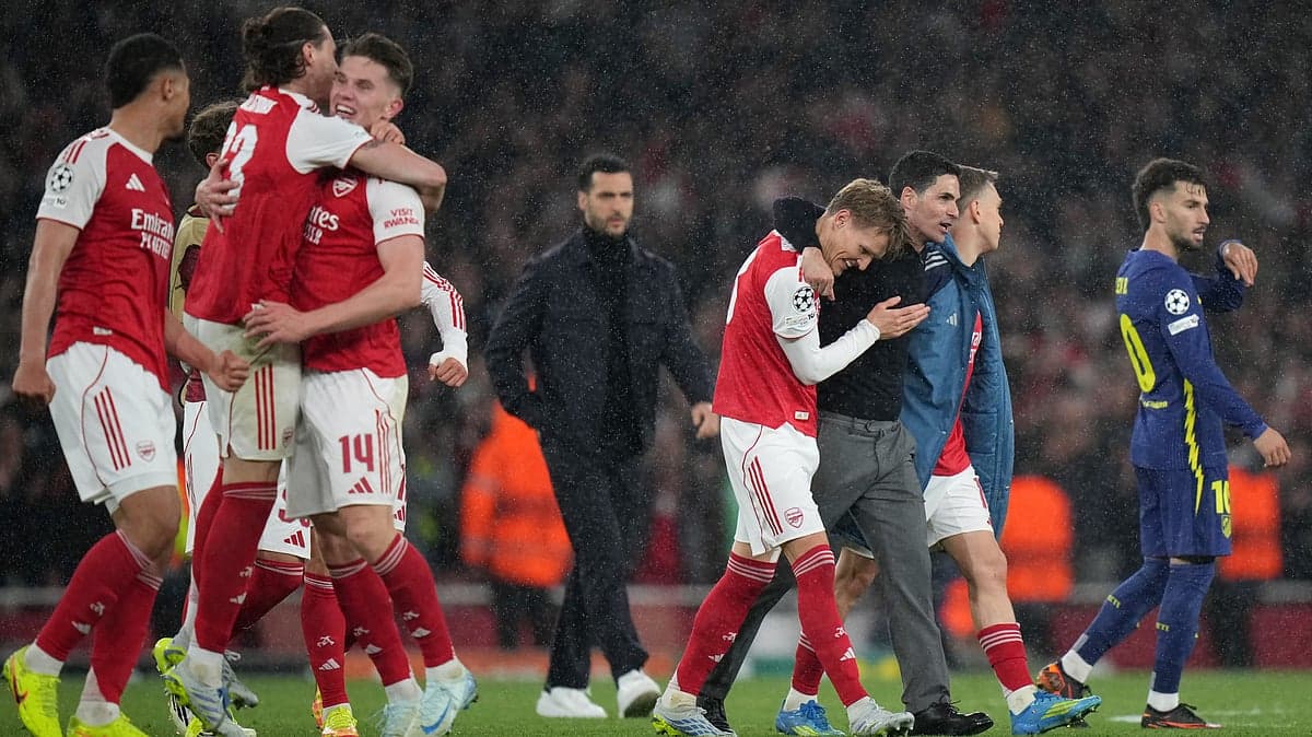 Arsenal players celebrating victory over Atletico Madrid