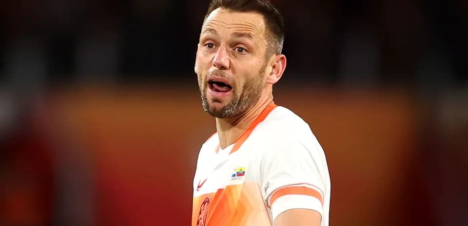 Player wearing orange jersey during match action
