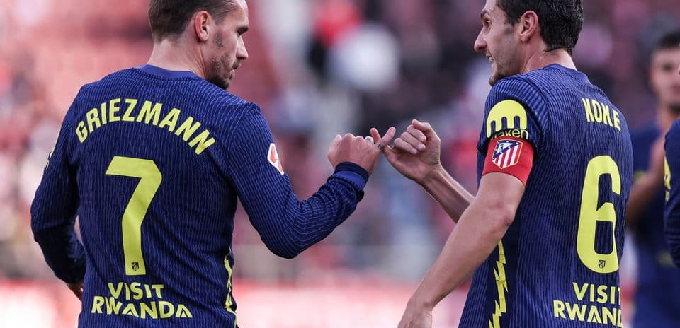Griezmann and Koke celebrating on the pitch