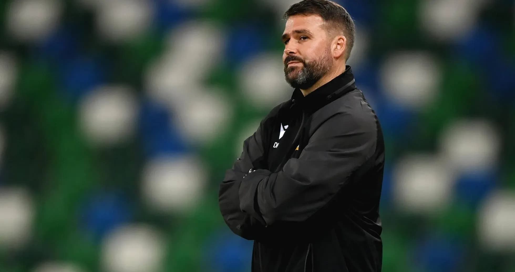 Coach observing the game from the sideline