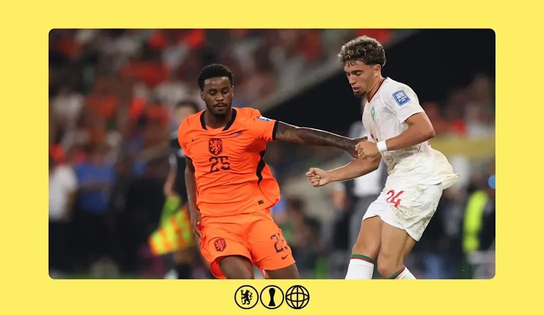 Players from Netherlands and Morocco competing for the ball