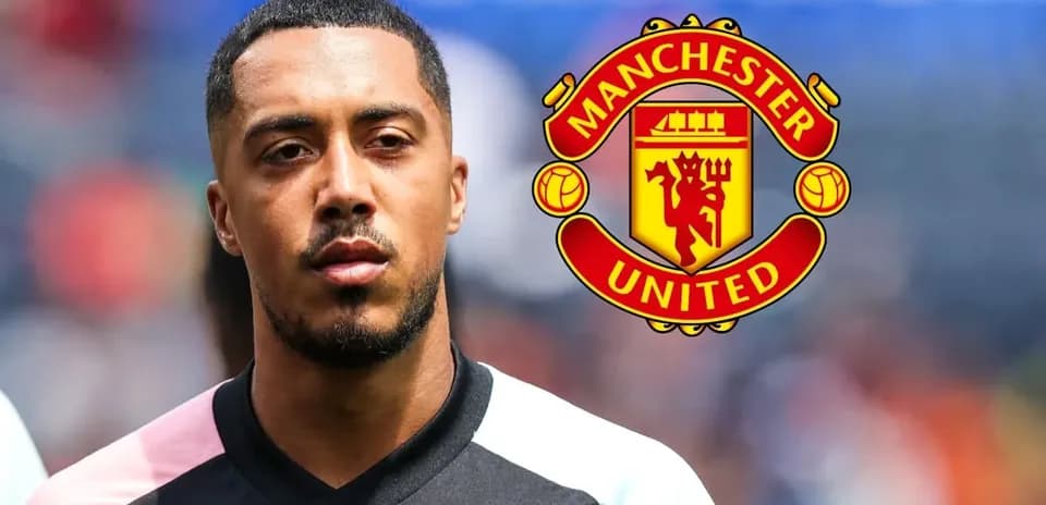 Player in black kit with Manchester United logo