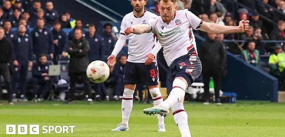 Player taking a shot on goal during match