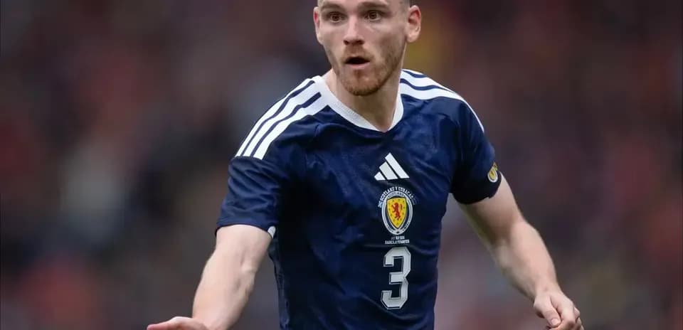 Player in Scotland kit gesturing during match