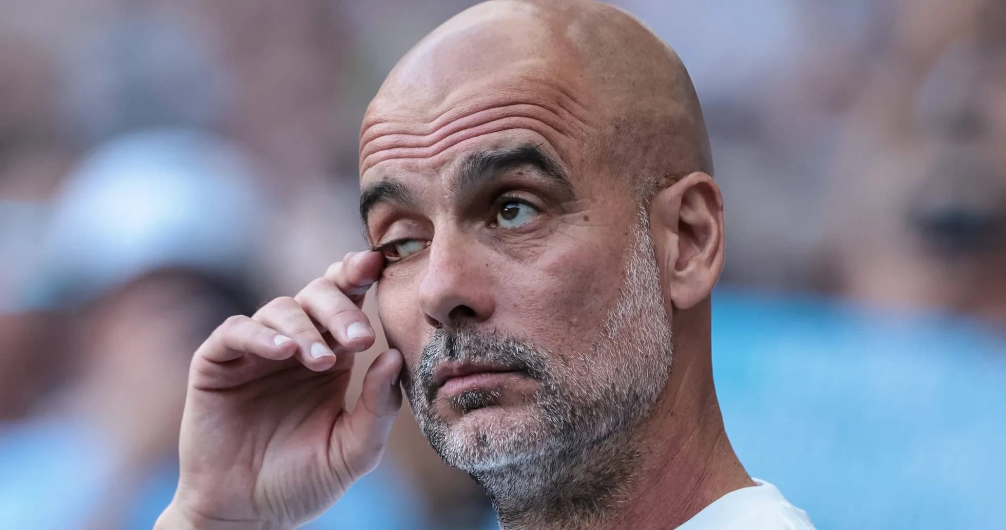 Coach wiping his eye during a match